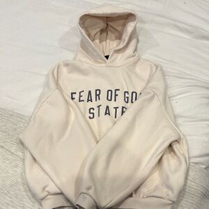 Essentials Cream Hoodie with Bold Lettering